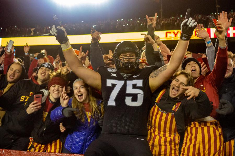 Then-redshirt+junior+Sean+Foster+celebrates+a+win+with+students+against+the+University+of+Texas+on+Nov.+16%2C+2019.+Iowa+State+won+23-21.