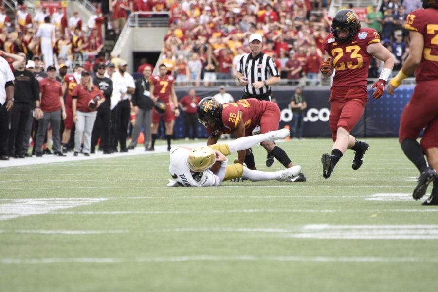 Iowa+State+cornerback+Anthony+Johnson+tackles+Notre+Dame+quarterback+Ian+Book+during+the+2019+Camping+World+Bowl.