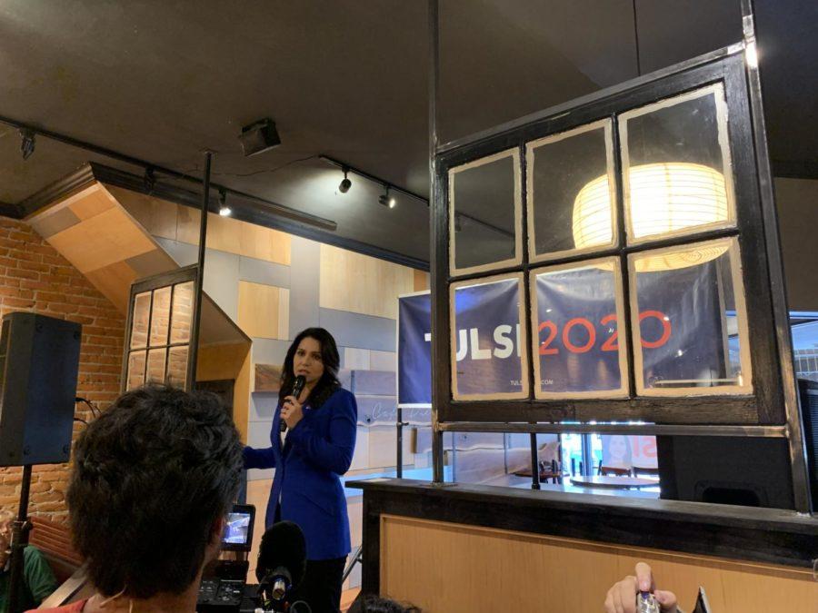 Rep. Tulsi Gabbard speaking to potential voters Saturday in Cafe Diem. Gabbard talked about her support for Medicare for All and the cost of Americas foreign wars.