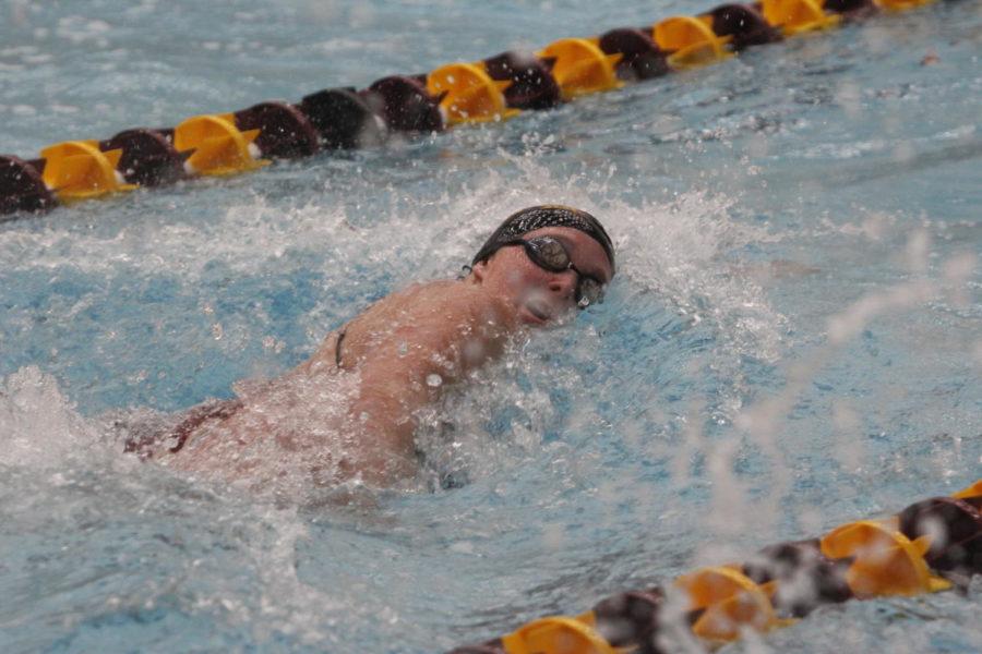 A member of the Iowa State Swimming and Diving team competes against West Virginia University on Jan. 26 in the 1000 Freestyle.
