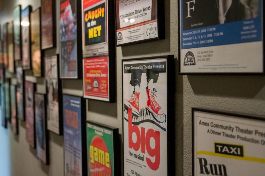 A wall full of past playbills is displayed at the Ames Community Theater (ACTORS). Behind the scenes at ACTORS, production roles such as co-producer and director require hard work and organization to put on a show.