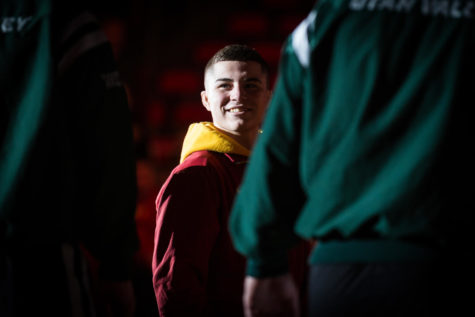 Then-redshirt freshman Austin Gomez smiles at his opponents before the start of the Iowa State vs. Utah Valley dual meet Feb. 3, 2019, at Hilton Coliseum. The Cyclones defeated the Wolverines 53-0.