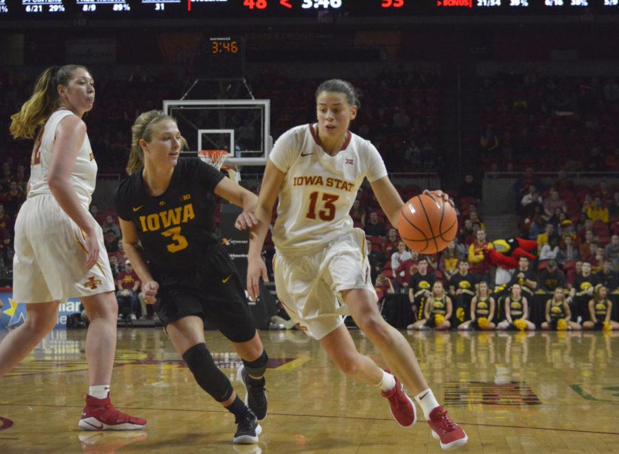 Then-sophomore+Adriana+Camber%2C+forward%2C+dribbles+toward+the+basket+during+the+game+against+University+of+Iowa+on+Dec.+6+at+Hilton+Coliseum.+The+Cyclones+lost+55-61.