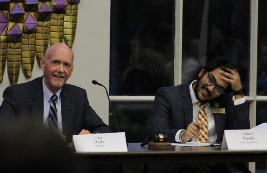Mayor John Haila and Student Government Vice President Vishesh Bhatia listen to the thoughts of council members at the joint city and student council meeting on Oct 23.