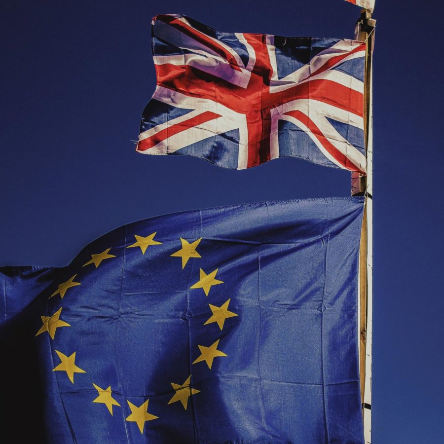 The United Kingdom flag (top) and the flag of Europe (bottom). The United Kingdom will withdraw from the European Union Friday.