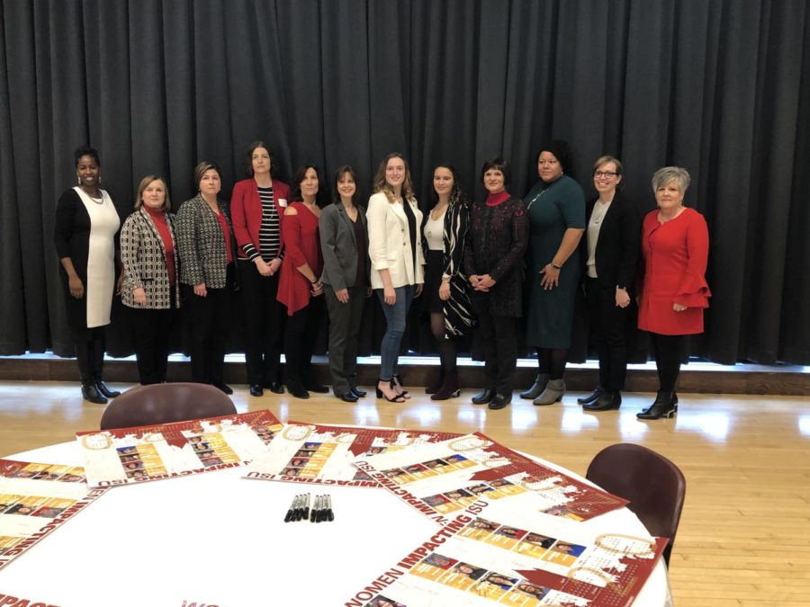 The 12 honorees of the Women Impacting ISU 2020 calendar pose for a photo after the event.