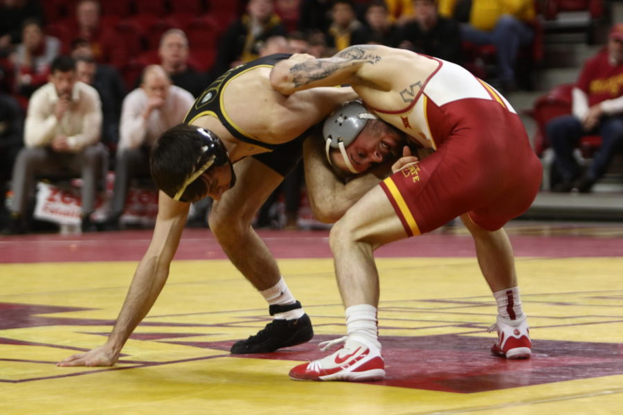 Iowa States then-redshirt sophomore Alex Mackall ties up with his opponent during the dual against Missouri on Feb. 24, 2018, in Hilton Coliseum.