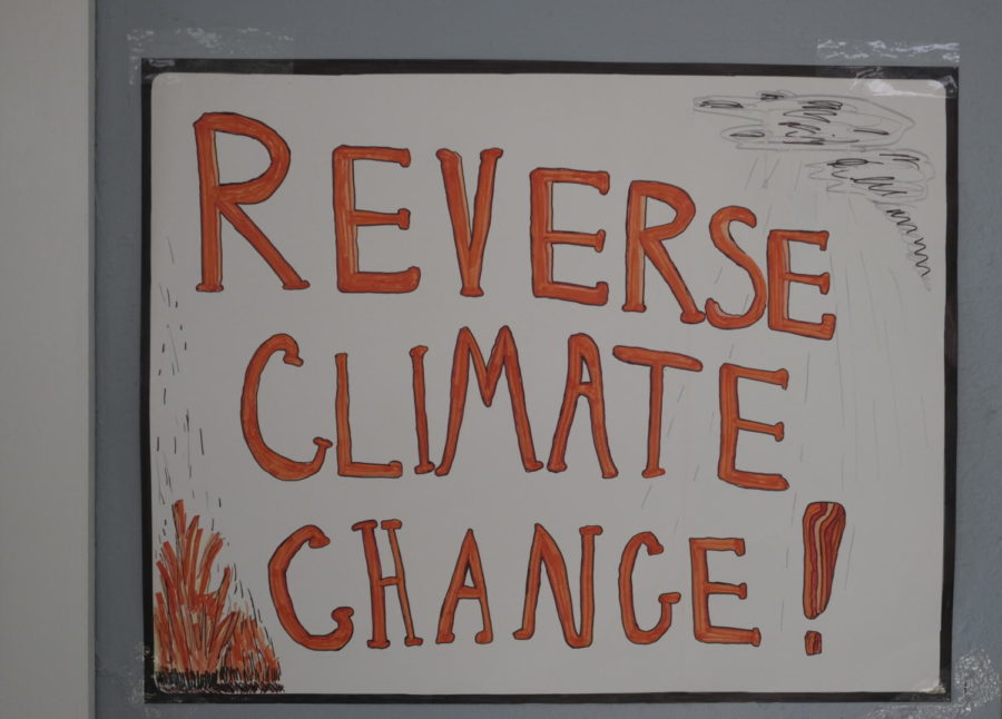 Climate change is a top issue for many students in the 2020 presidential election. A whiteboard reading, REVERSE CLIMATE CHANGE, sits in the Bernie 2020 Ames Headquarters.