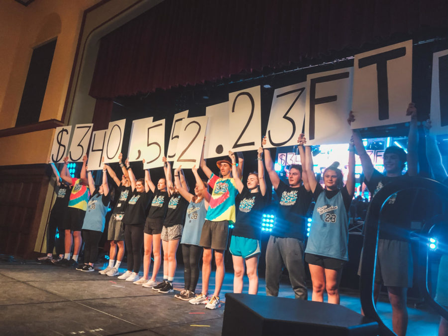 Dance Marathon raised a total of $340,552.23. Students held up the total for the audience to see.