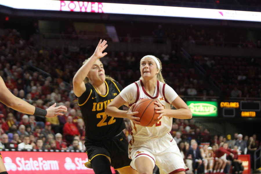 Iowa State freshman guard Maggie Espenmiller-McGraw drives to the hoop against Iowas Kathleen Doyle on Dec. 11th.