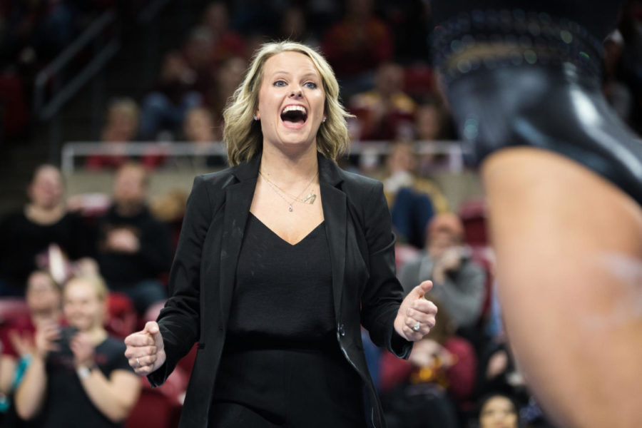 Iowa State gymnastics assistant coach Kristin White cheers following a stuck landing on beam from freshman Grace Woolfolk during the third rotation of the Iowa State vs Oklahoma gymnastics meet on March 11, 2019.