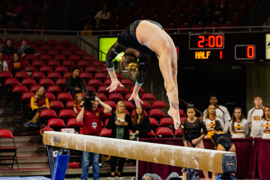 Then freshman Ana Palacios competes in the bar event during the gymnastics meet against the Oklahoma Sooners on March 11, 2019 in Hilton Coliseum. 