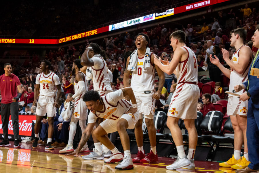 The Cyclones bench reacts to Carter Boothes three pointer against Texas on Feb. 15 in Hilton Coliseum.