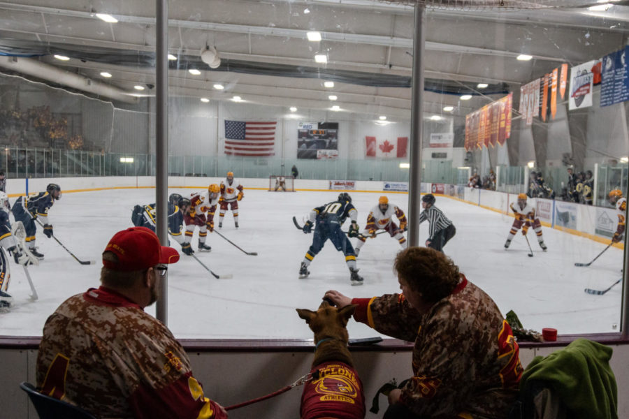 Some spectators watch the Cyclone hockey game against Central Oklahoma with their dog on Feb. 1st.