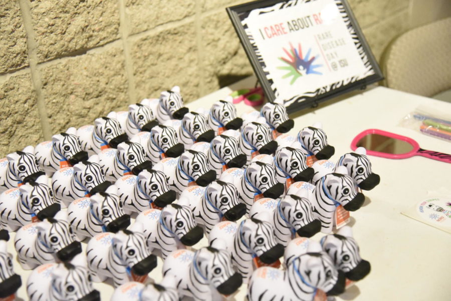 A table at an event hosted the Iowa State Rare Disease Awareness Club shows zebras, which is the international image of the day.