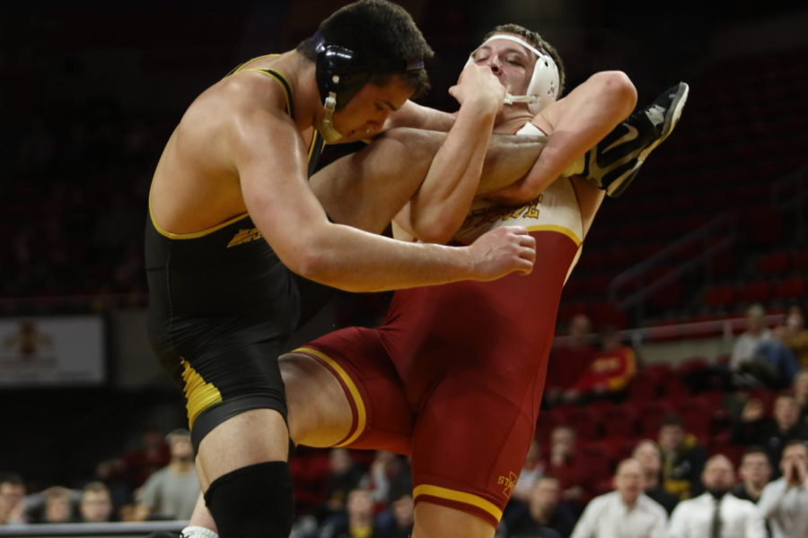 Iowa State then-redshirt sophomore Gannon Gremmel attempts a takedown during the dual against Missouri on Feb. 24.