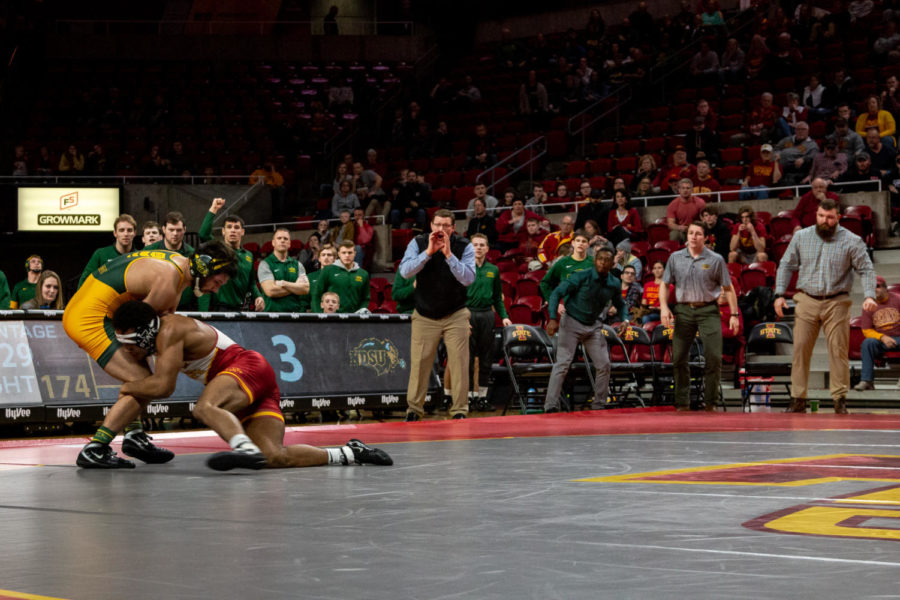 Marcus Coleman attempts to take down T.J. Pottinger in Iowa State's 22-16 victory over North Dakota State on Feb.23 in Hilton Coliseum. 