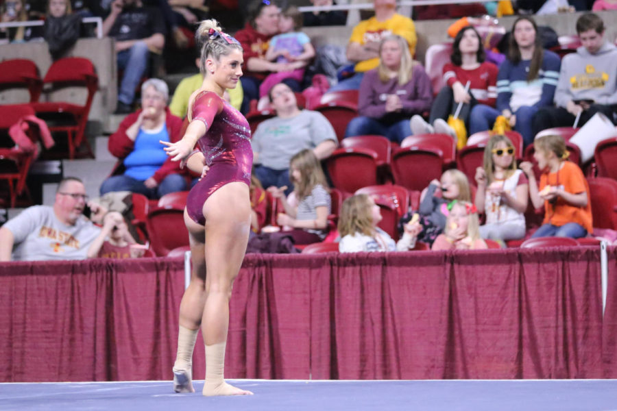 Then sophomore Sophia Steinmeyer poses for the crowd during her floor routine on March 15, 2019 against Denver. Denver won 197.225 to 195.925.
