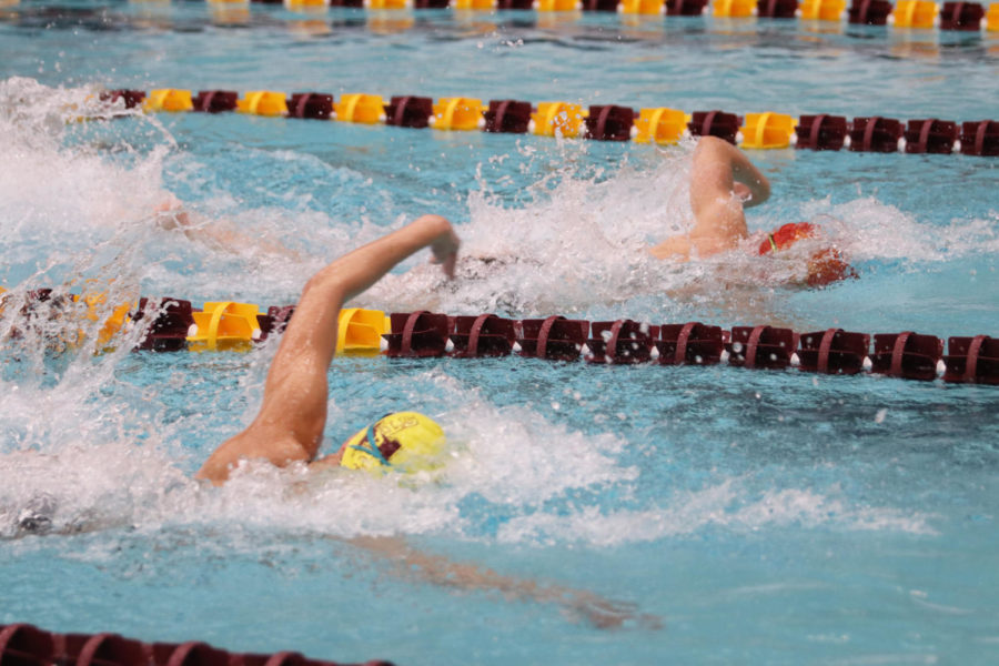 Members of the Iowa State swimming and diving team compete in a relay race during the Cardinal and Gold swim meet Oct. 12, 2018, at Beyer Hall.