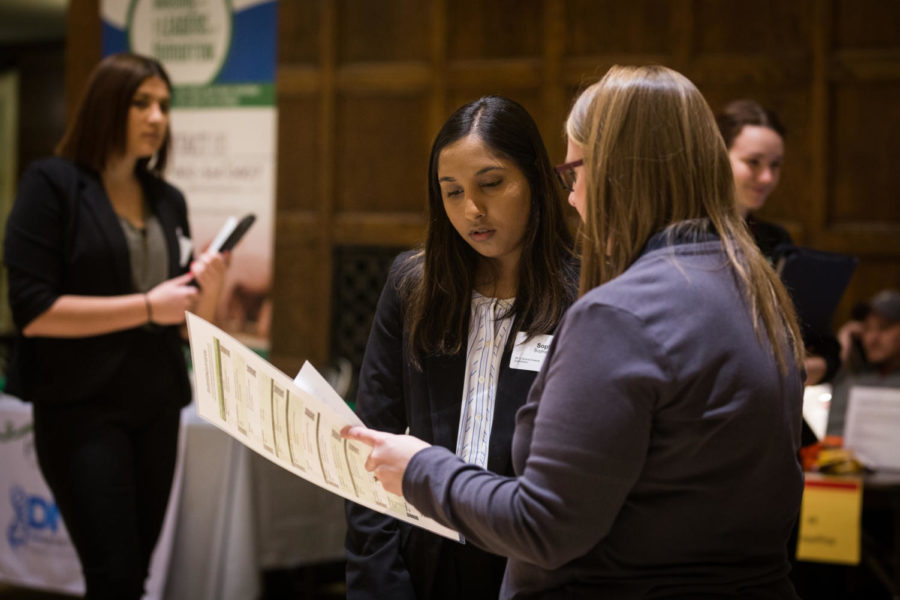 Sophia Puff is shown different job opportunities within the company by a Cargill representative during the College of Agriculture and Life Sciences Career Fair held Feb. 6, 2019 in the Great Hall of the Memorial Union.