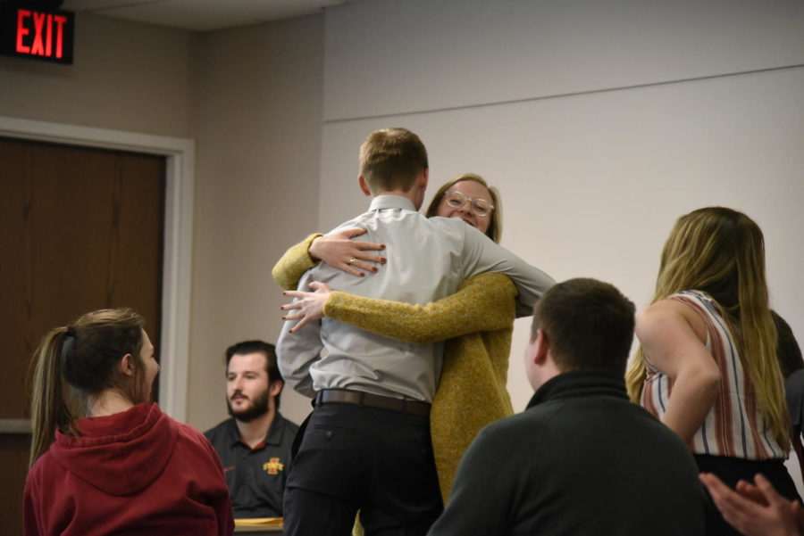 Morgan Fritz, sophomore in political science, and Jacob Schrader, junior in economics and political science, embracing each other after they are elected Student Government president and vice president.