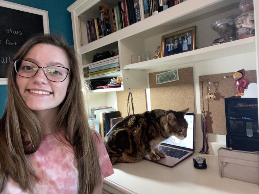 Columnist Peyton Hamel poses in her new workspace at home for social distancing. 