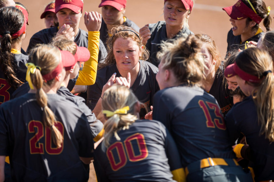 Members of the Iowa State softball team huddle up before the start of the Iowa State vs. University of South Dakota softball game April 2, 2019, at the Cyclone Sports Complex. The Cyclones had three home run hits and defeated the Coyotes 9-1.