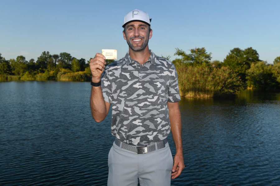 Former Iowa State golfer Chris Baker holds up his name after earning a PGA Tour card Sept. 2, 2019.