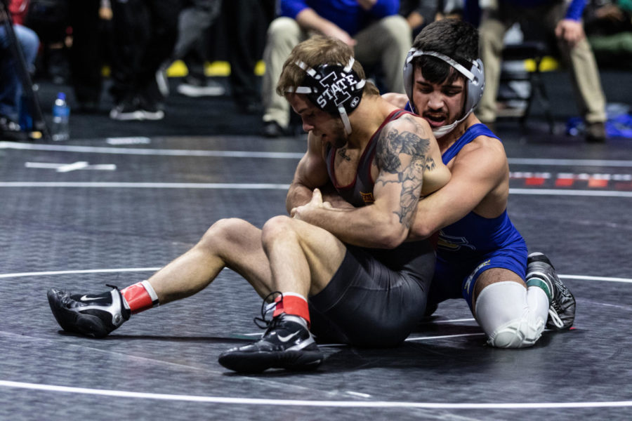 Iowa States Alex Mackall and South Dakota States Danny Vega wrestle for position in their 125 pound quarterfinal matchup on March 7 at the Big 12 Championships inside the Bank of Oklahoma Center in Tulsa.
