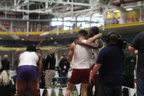Senior Roshon Roomes (right) and sophomore Cebastian Gentil (left) lean on each other after finishing first and second, respectively, in the mens 600-yard run at the 2020 Big 12 Indoor Track and Field Championships. Roomes also won the mens 800-meter run.