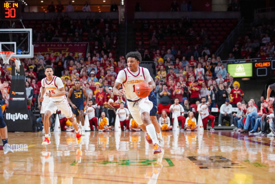 Senior guard Prentiss Nixon dribbles the ball up the court against West Virginia in Iowa States last home game of the season at Hilton Coliseum.