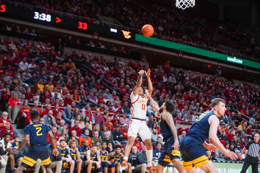 Senior guard Prentiss Nixon attempts a shot against West Virginia on March 3 in Iowa States final home game of the season at Hilton Coliseum.