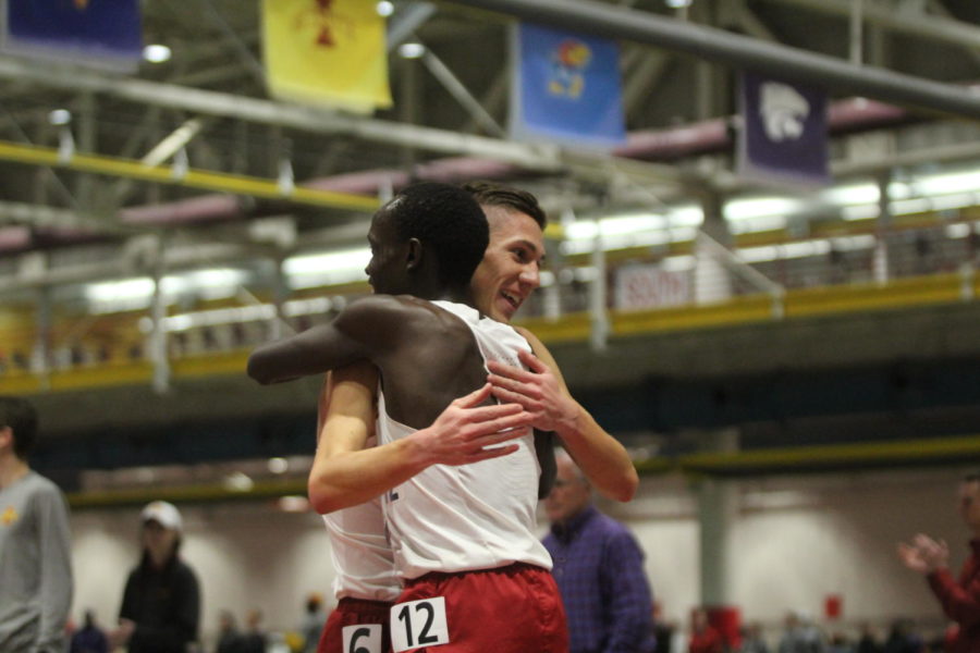 Senior Edwin Kurgat and then-redshirt junior Thomas Pollard give each other a hug after finishing in first and second in the mens 3,000-meter run at the 2020 Big 12 Indoor Track and Field Championships.