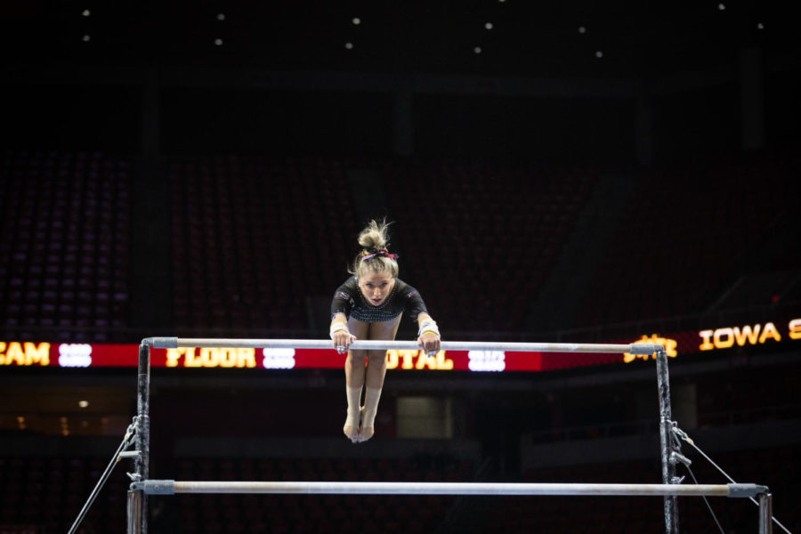 Iowa State then-junior Laura Burns competes on bars during the second rotation of the Iowa State vs. Oklahoma gymnastics meet on March 11. The No. 23 ranked Cyclones were defeated by the No. 1 ranked Sooners 196.275-197.575