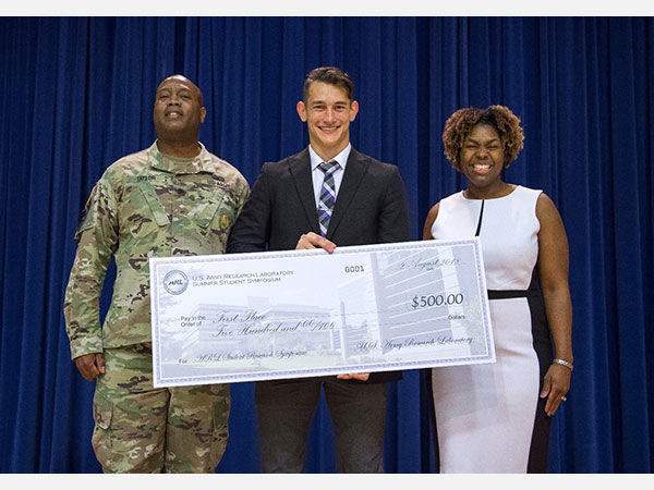 Nikita Kozak receiving one of his first place prizes in 2018 at the U.S. Army Research Laboratory.