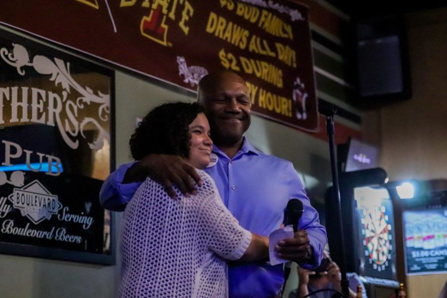 Newly elected State Rep. Ross Wilburn hugs his daughter Alex at Mother’s Pub after she announces him to a crowd of supporters on Aug. 6. Wilburn has previously served as mayor of Iowa City. 