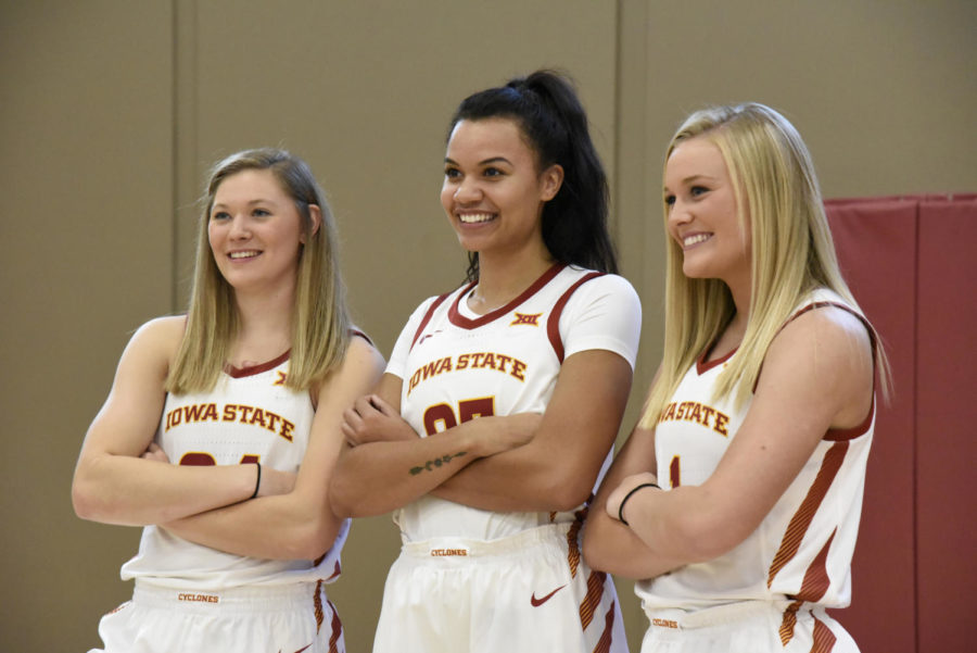 From left to right, Ashley Joens, Kristin Scott and Madison Wise pose for photos Oct. 7, 2019, at womens basketball media day.