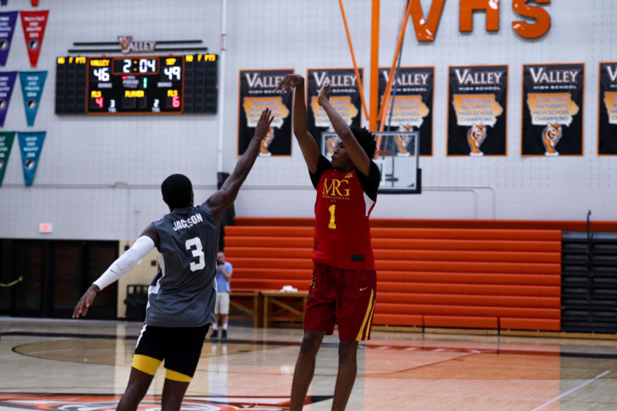 Iowa State forward Javan Johnson shoots over Iowa State guard Tre Jackson during the championship game of the YMCA Capital City League Tournament on July 21, 2019, at Valley High School in West Des Moines. 