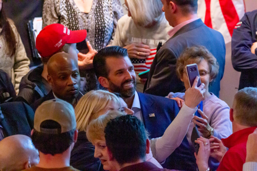 Donald Trump Jr. takes selfies with supporters of his father President Donald Trump at the 2020 Iowa Republican caucus Feb. 3 at the Oakwood Road City Church in Ames.
