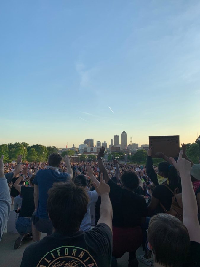 Protesters encouraged each other to not get involved in violent activity. Some were talking with police officers at the location and state patrol officers watched the protest from a distance at the Capitol doors, while a seemingly unmarked helicopter and drone cut through the air above unbothered.