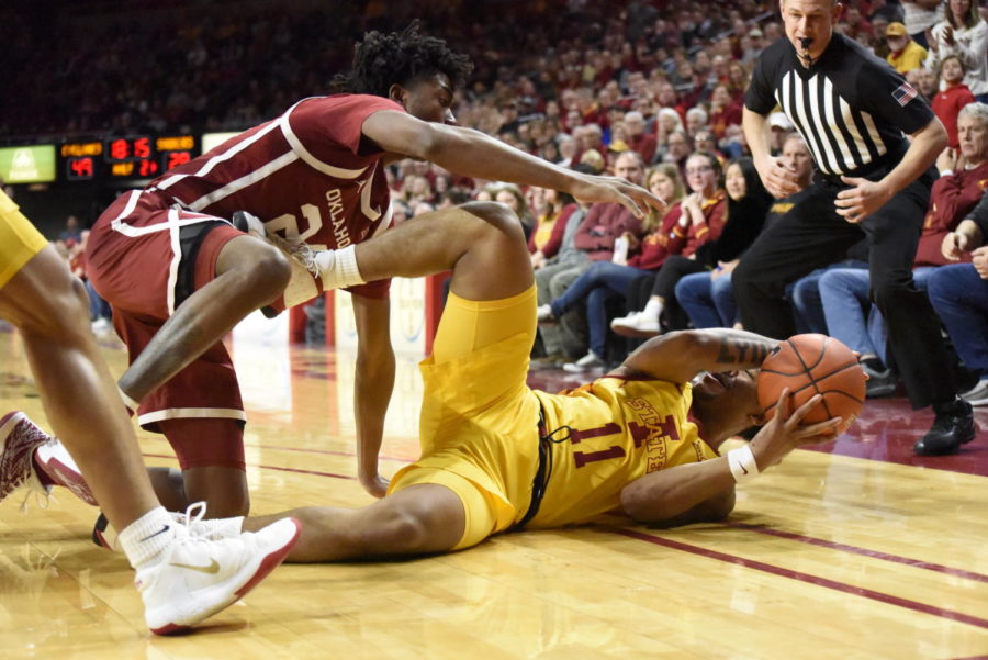 Senior guard Prentiss Nixon fighting for a ball during the Iowa State basketball game against Oklahoma on Jan. 11.