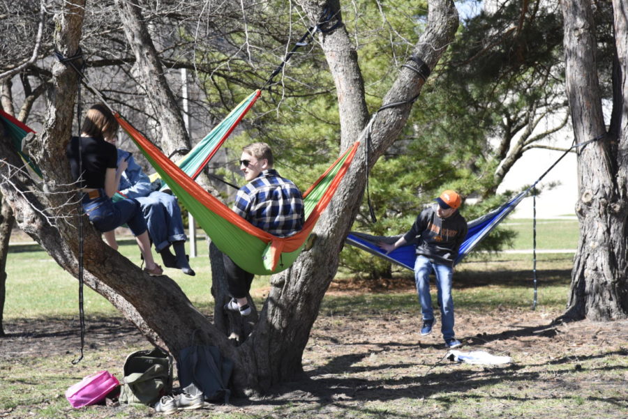 People were scattered across the Iowa State campus throughout the day on March 30 enjoying the weather. A day before, President Donald Trump said he was extending the social distancing order another 30 days through April.