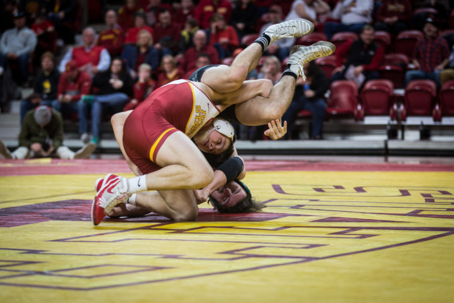 165-pound then-freshman Zane Mulder takes down Utah Valley Koy Wilkinson during the Iowa State vs Utah Valley dual meet Feb. 3 in Hilton Coliseum. Mulder won by major decision 10-2 and the Cyclones defeated the Wolverines 53-0.
