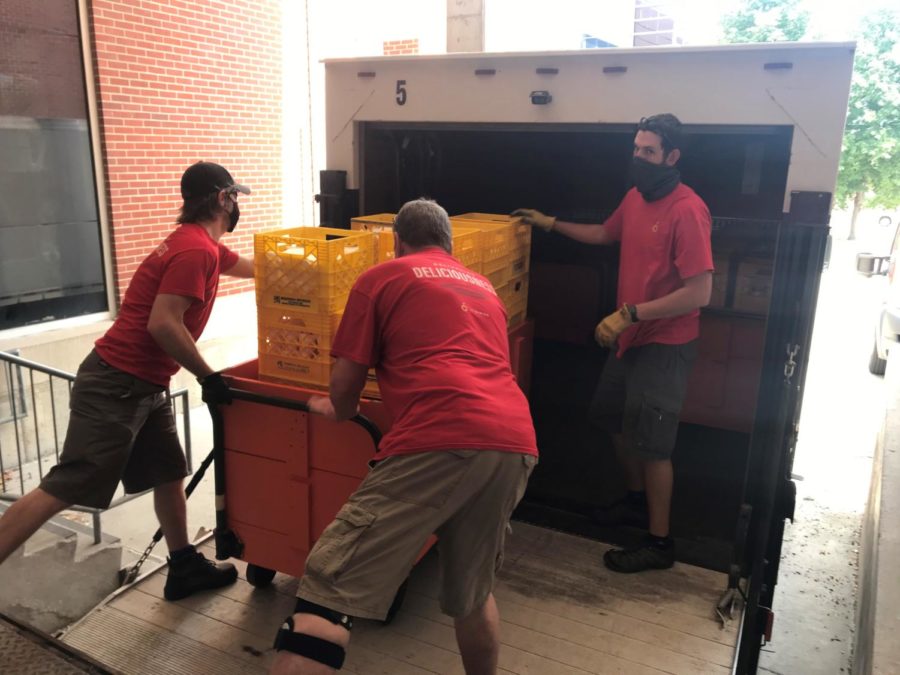 The+Iowa+State+University+Food+Pantry+staff+members+help+load+ice+cream+into+their+refrigerated+truck+for+delivery+to+local+organizations.