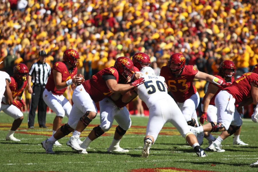 Members of the Iowa State football team offensive line attempt to take down Brock Boxen of University of Akron (from the Mid-American Conference) during their game at Jack Trice Stadium on Sept. 22, 2018. The Cyclones won 26-13.