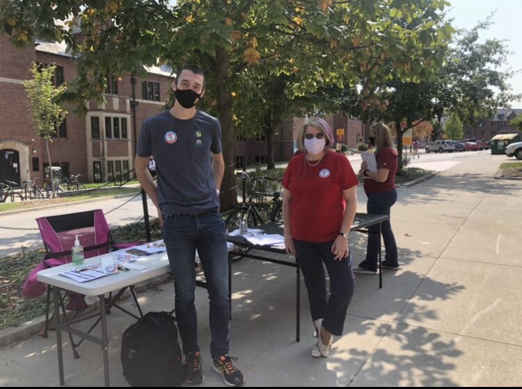 Karen Kedrowski, director of the Carrie Chapman Catt Center for Women in Politics and Zach Johnson, president of Vote Everywhere, assist students on campus to register to vote for National Voter Registration Day.
