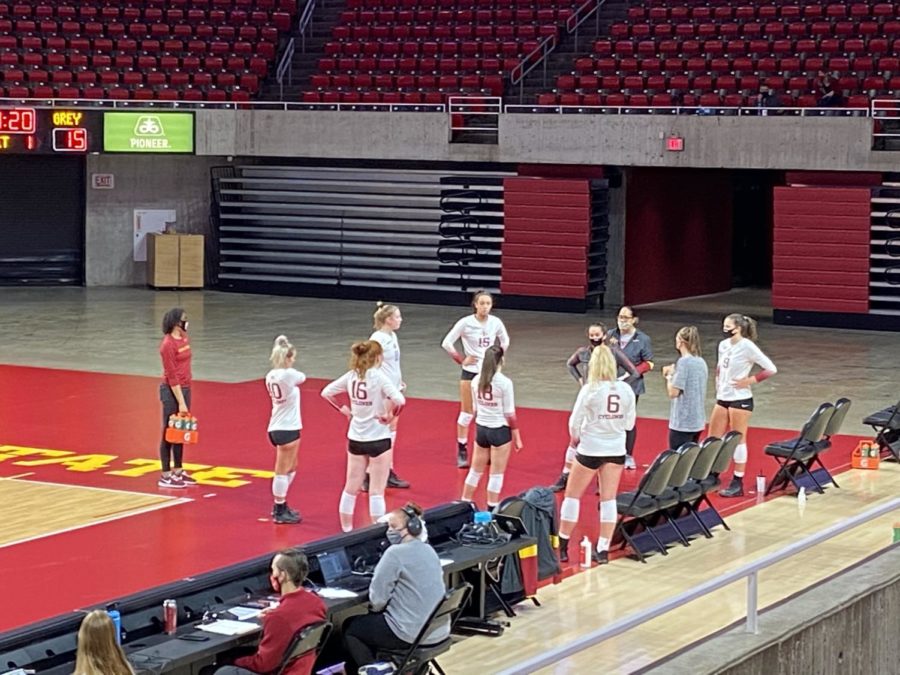 Members of team white in Iowa States scrimmage Saturday, socially distancing during a timeout. 