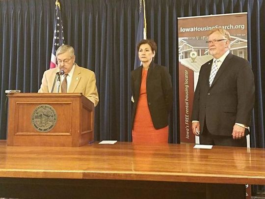 Then-Gov. Terry Branstad, then-Lt. Gov. Kim Reynolds and then-Iowa Finance Authority Director Dave Jamison during a press conference April 10, 2017.