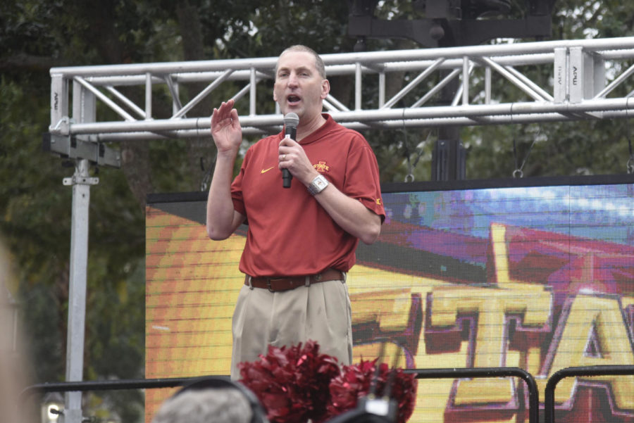 Athletic Director Jamie Pollard speaks to Iowa State fans who packed the Pointe Orlando Plaza during the Camping World Bowl fan pep rally.