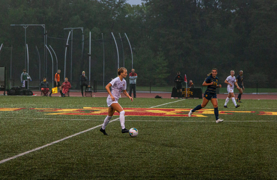 Sophomore defender McKenna Schultz dribbles the ball through midfield. The Cyclones fell in their season opener 2-0.